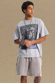Gray oversized graphic tee with a distressed print and crew neck.