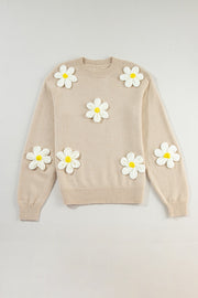 Tan knit sweater with embroidered white and yellow daisies, crew neck, long sleeves.