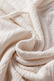 Textured sleeve henley blouse in Dust Storm, showing cable knit details.