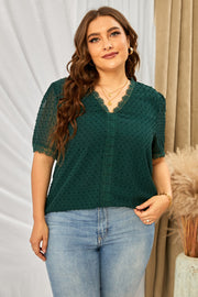 Dark green textured dot blouse with lace trim neckline and sleeves.