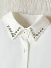 White toddler collar shirt with rhinestone trim and decorative button detail