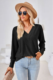Black textured V-neck blouse with button cuff detail