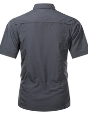 Men's dark gray short sleeve button-up shirt with collar and back yoke detail