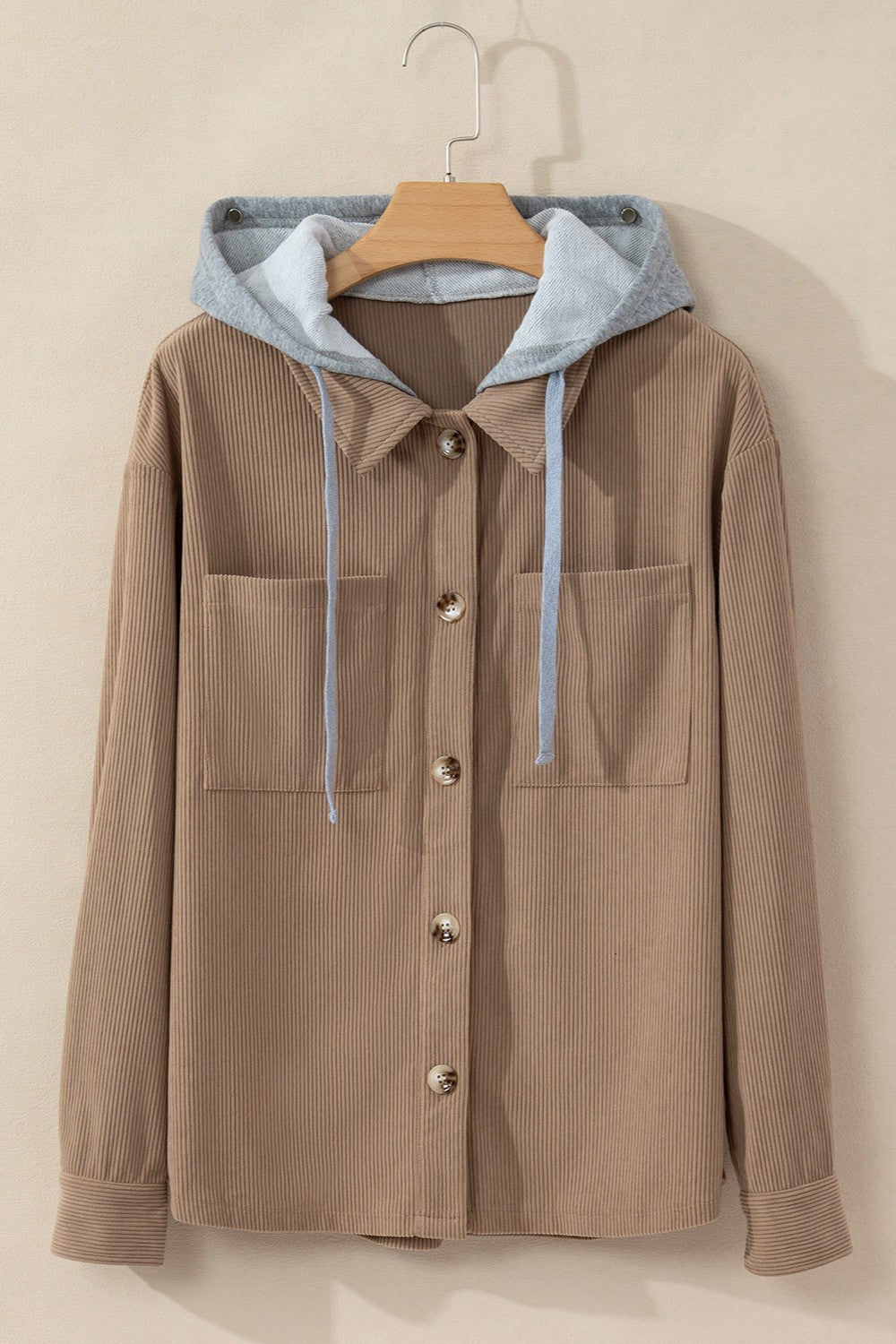 Mocha corduroy shirt jacket with contrast gray hood and button front.