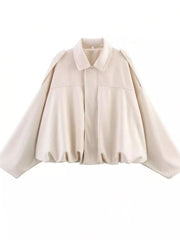 Oversized off-white zip-up jacket with a collared neckline and balloon sleeves.