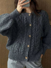 Gray cable-knit button-down cardigan with crew neck and balloon sleeves.