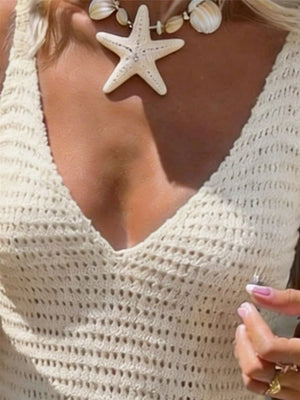Apricot openwork V-neck sweater dress with crochet detail and frill hem.