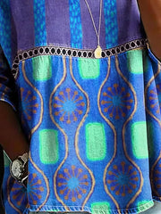 Bohemian maternity t-shirt in blue with floral and geometric print, featuring openwork trim.