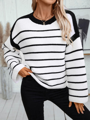 Contrast stripe knit sweater with wide sleeves and crew neck, black and white.