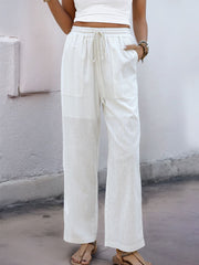 White linen-blend wide-leg trousers with drawstring waist and patch pockets