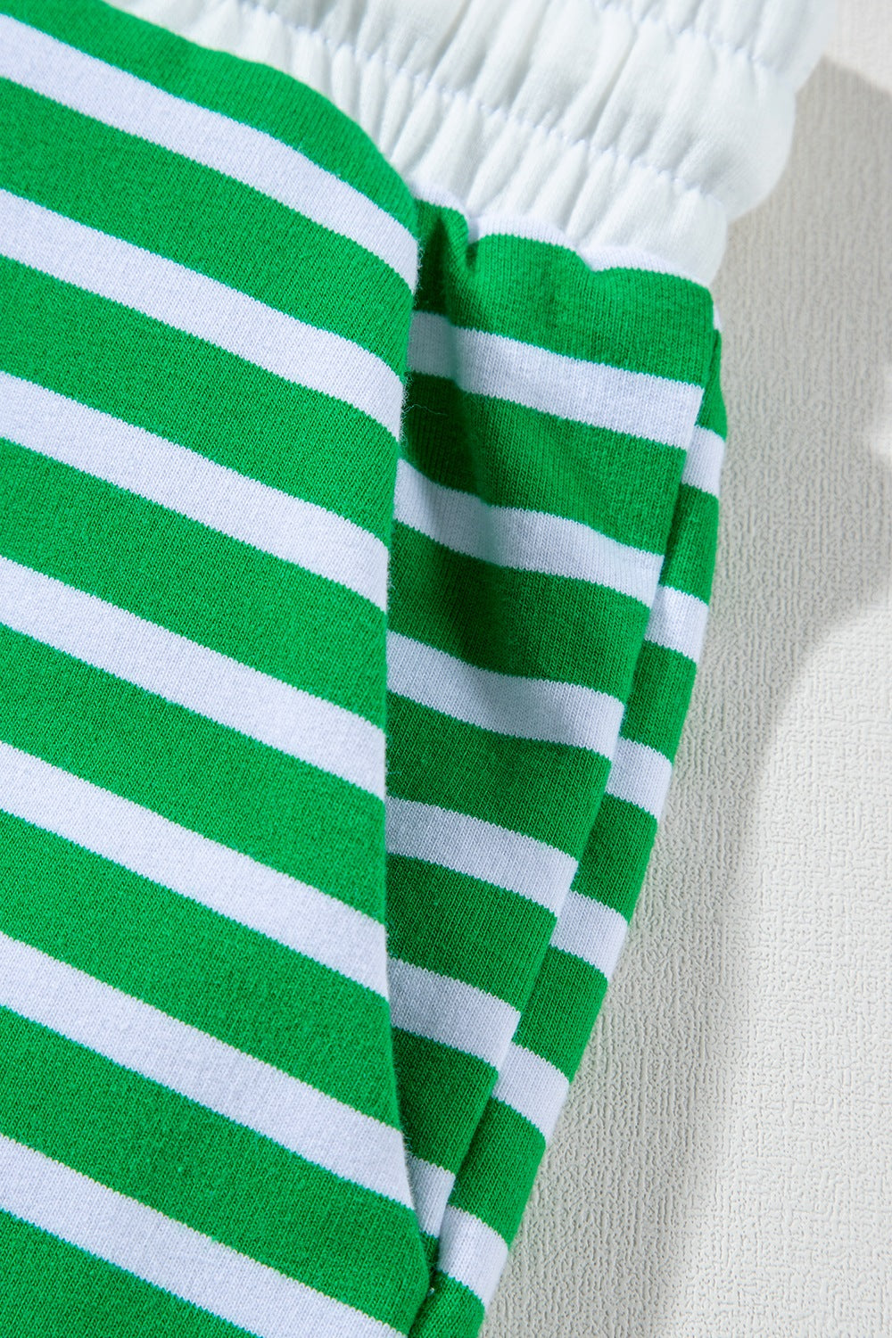 Green and white striped cotton loungewear shorts with elastic waistband detail