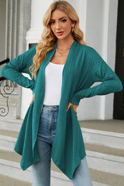 Turquoise textured knit cardigan with asymmetrical drape front and long sleeves.