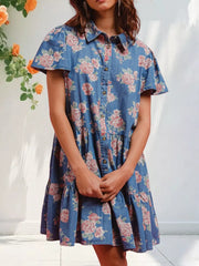 Floral denim mini dress with ruffled tiers and short sleeves.