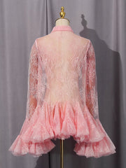 Pink floral lace dress with ruffled hem and long sleeves.