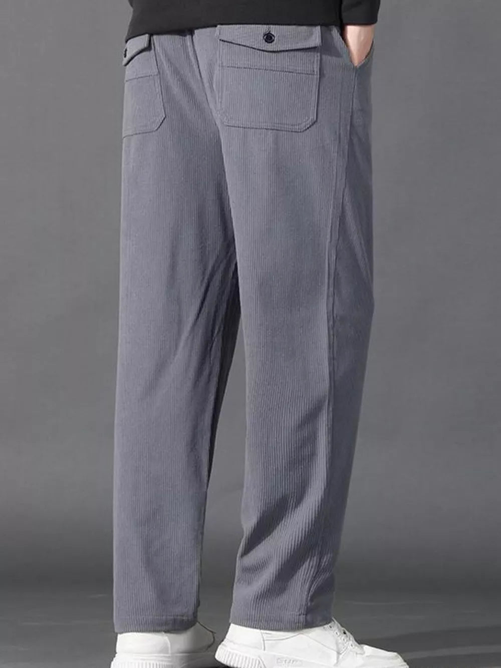 Light gray corduroy joggers with back flap pockets and drawstring waist.