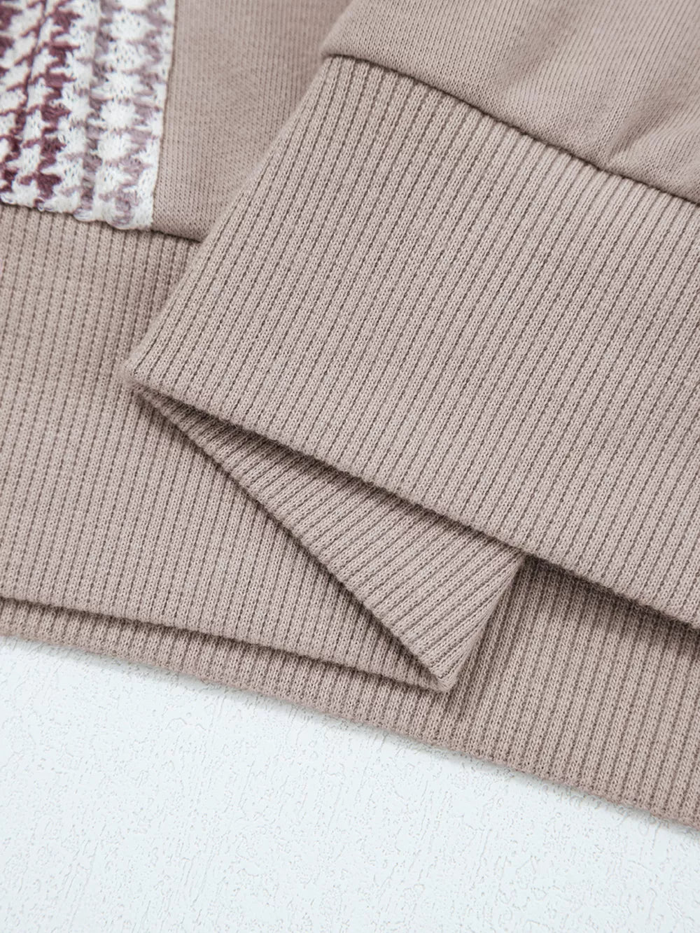 Relaxed fit cotton hoodie in taupe with textured knit detail on the chest and ribbed cuffs.