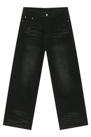 Faded black baggy denim trousers with a relaxed fit and visible whiskering details.