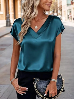 Teal satin V-neck short sleeve maternity shirt with a relaxed fit.