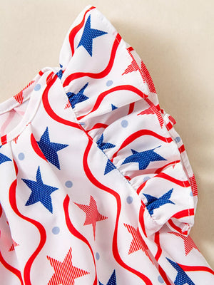 Toddler dress with white, red, and blue star print and ruffle sleeves.
