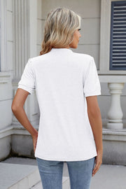 White pleated yoke keyhole tee with short sleeves.