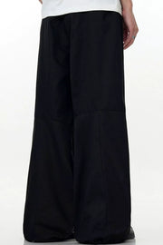 Men's black wide leg casual cargo pants with a relaxed fit.