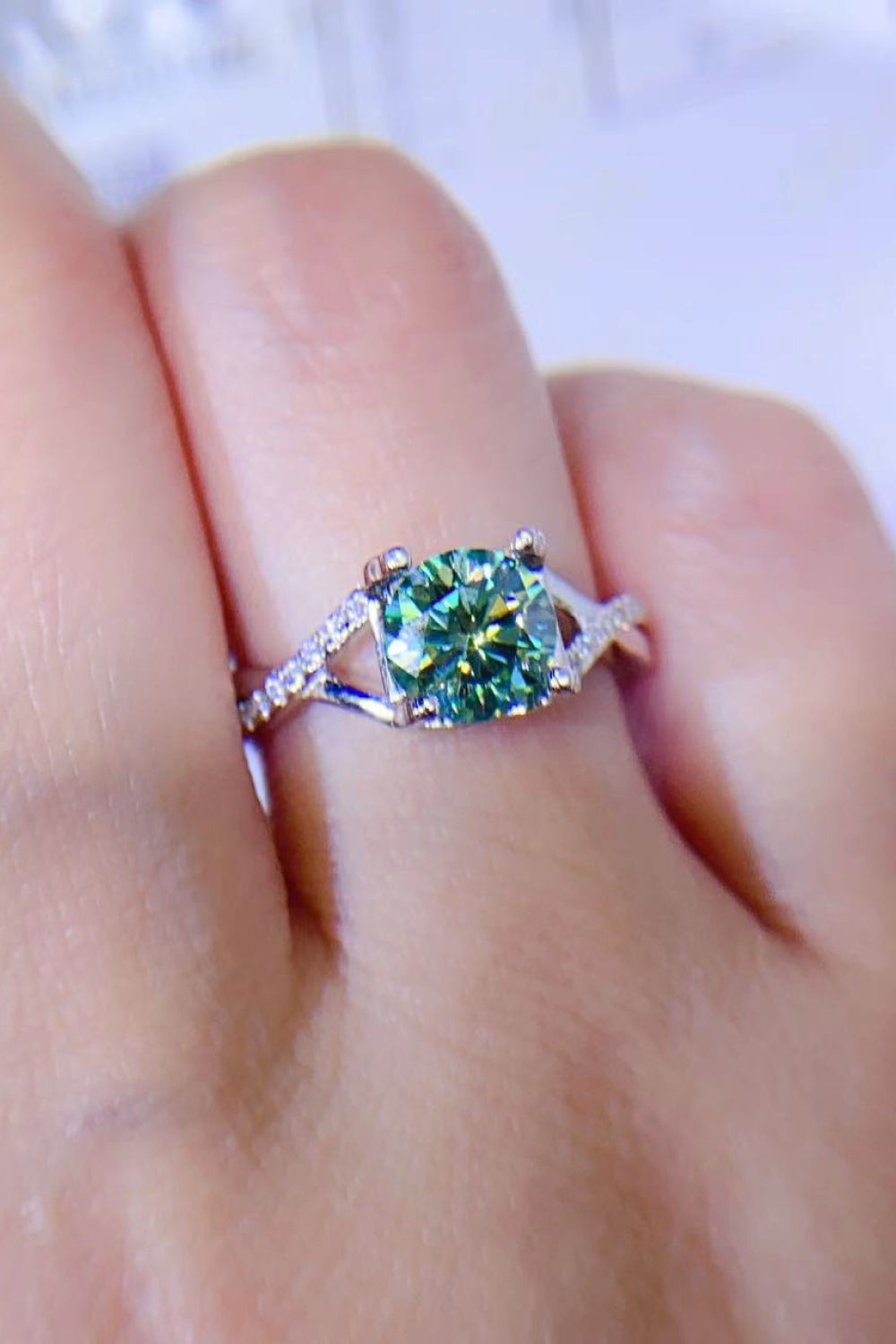 Veridian Halo Sterling Ring with light green stone and diamond band.