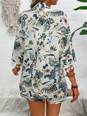 Light green botanical print kimono with tassel trim and matching shorts.
