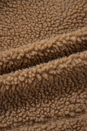 Brown sherpa jacket lining detail, soft fuzzy texture