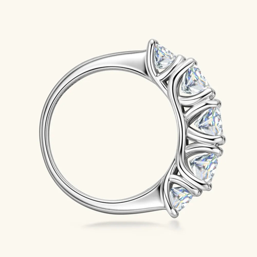 Silver band ring with five sparkling moissanite stones.