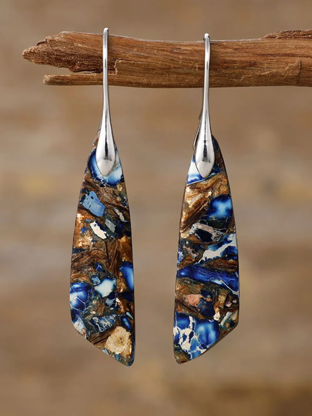 Azure stone teardrop earrings with blue and gold marbling, silver-tone hooks.