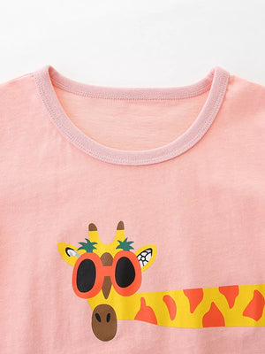 Pink cotton crew neck toddler t-shirt with a fun giraffe graphic wearing sunglasses.
