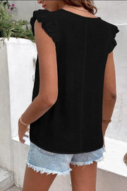Black flutter sleeve blouse with embroidered trim detail.