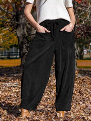 Black corduroy wide-leg pants with drawstring waist and pockets