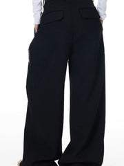 Men's black cotton wide-leg trousers with braided cord detail and back pockets.