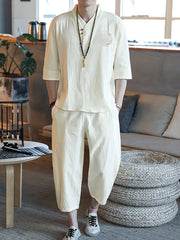 Men's relaxed 3/4 sleeve pants set in cream, featuring a V-neck top with button closure and embroidered detail.