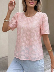 Pink embroidered floral sheer blouse with pearl trim and puff sleeves.