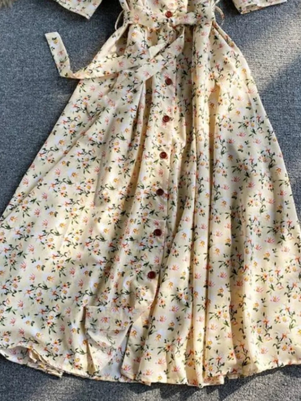 Apricot floral v-neck midi dress with button front and belted waist