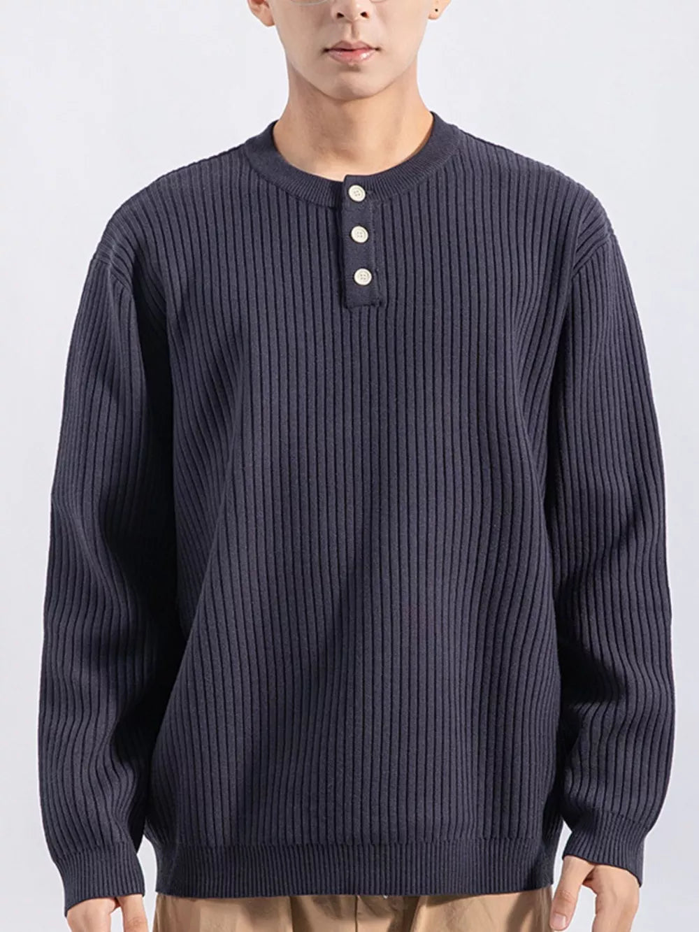 Men's dark gray ribbed knit top with three button details at the neckline.