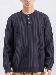 Men's dark gray ribbed knit top with three button details at the neckline.