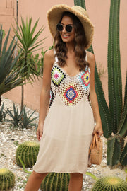 Apricot crochet yoke maxi dress with colorful floral squares and a flowing skirt.