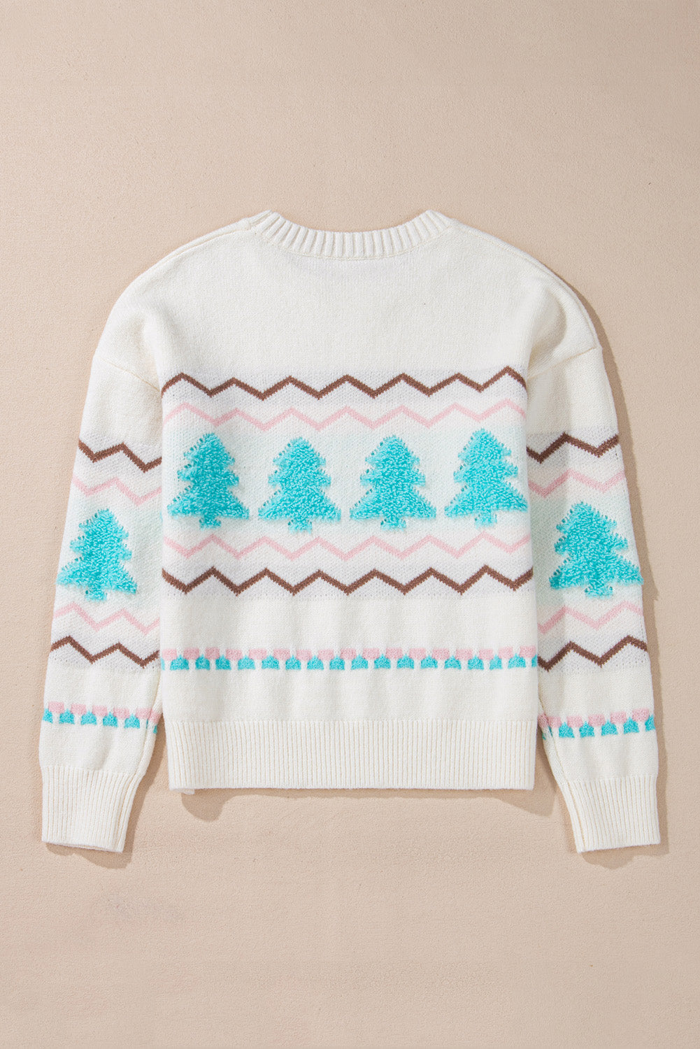 White knit sweater with textured tree motif and zigzag stripes.
