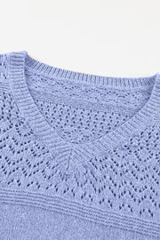 Light blue perforated knit v-neck pullover sweater with openwork detail.