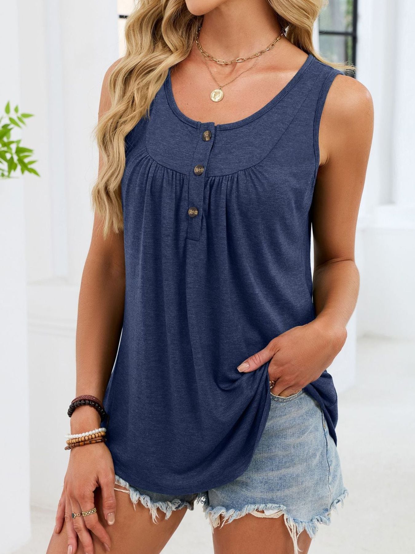 Navy blue ruched tank top with button detail and curved hem