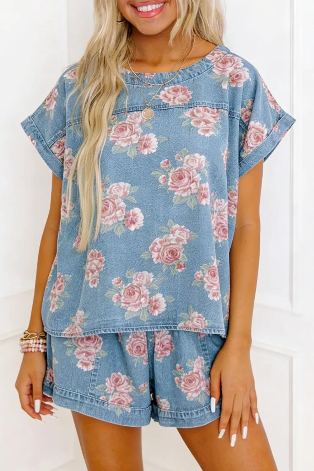 Floral denim two-piece set with boxy top and shorts, featuring pink roses pattern.