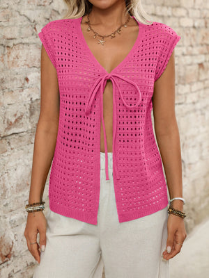 Fuchsia pink open-knit sleeveless cardigan with tie-front detail and V-neck.