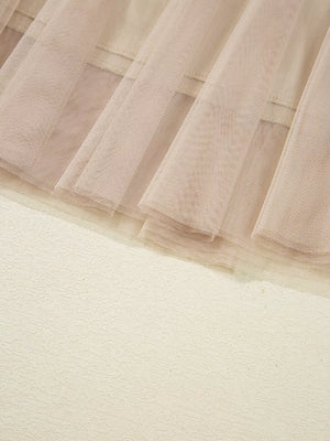 Lace overlay flared midi skirt in beige with textured fabric detail.