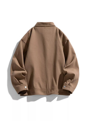 Oversized casual jacket in camel brown cotton with snap details and a collared neckline.
