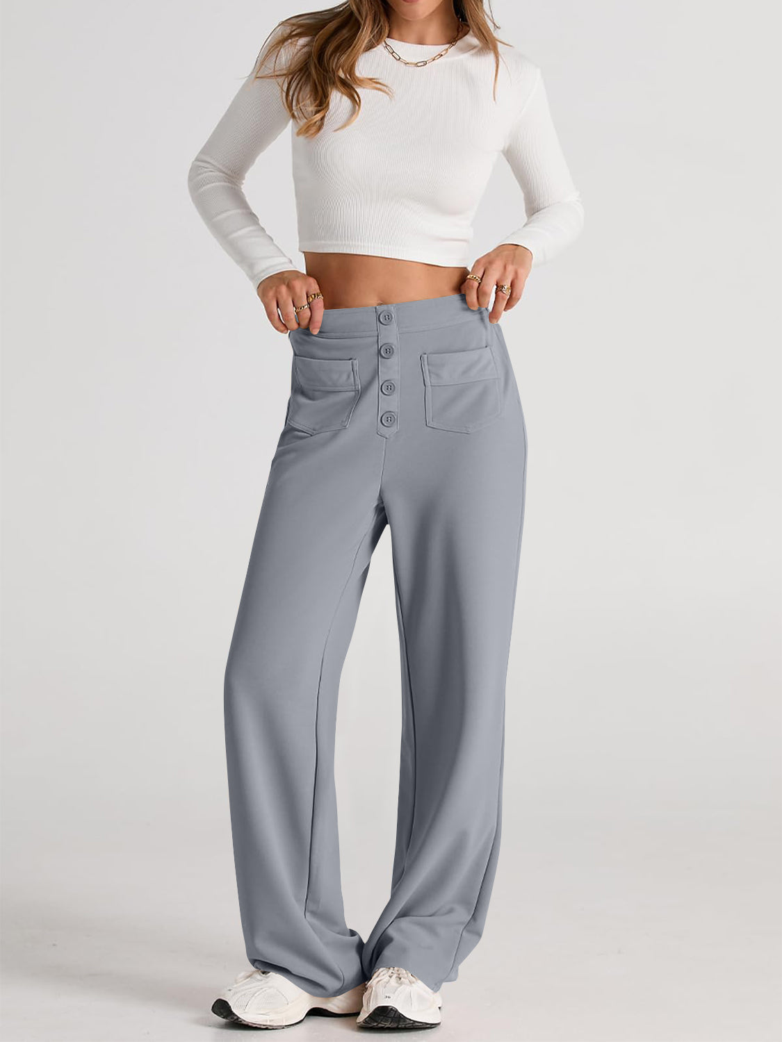 Gray button-front palazzo trousers with flap pockets and a wide leg.