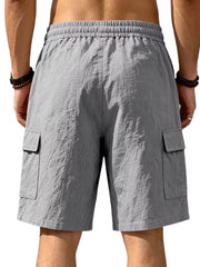 Dark gray cargo shorts with drawstring waist and crinkled texture.
