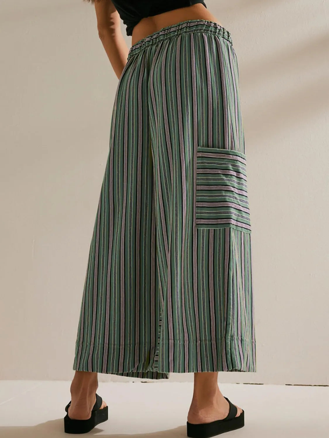 Moss green striped culottes with cargo pocket detail and elastic waistband.